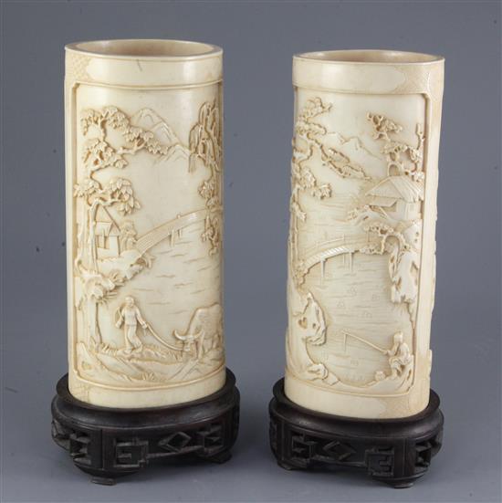 A pair of Chinese ivory vases, early 20th century, 28 and 28.5cm, later holes to stands